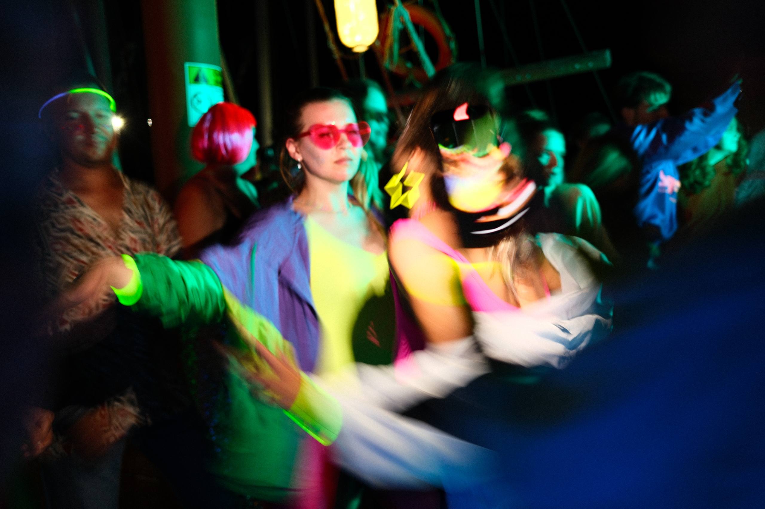 Night party, neon lights on yacht deck